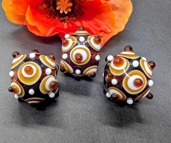 Augenperle Bernsteinbraun weiß